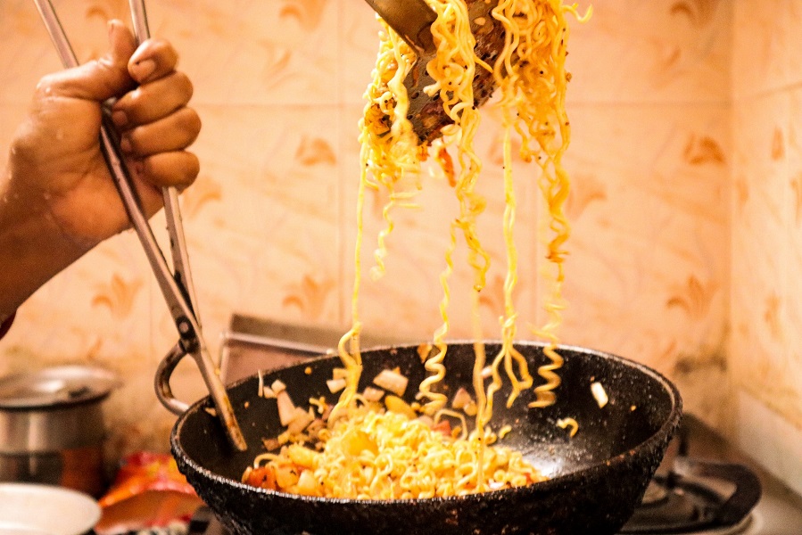 cooking noodles in a frying pan