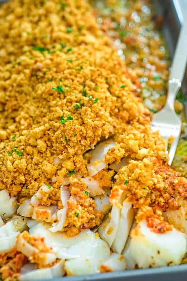 A bowl of cod fish and veggies