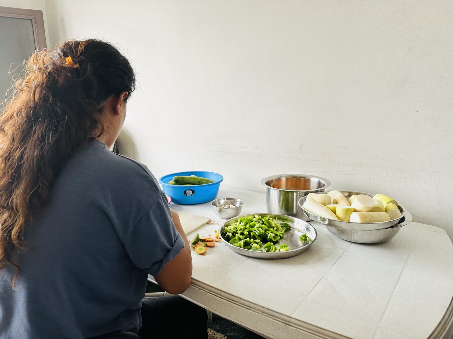 A woman cooks food at home