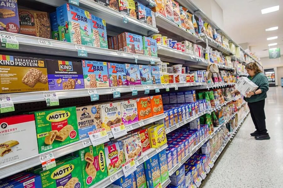 A shop displays ready to eat protein bars on a shelf
